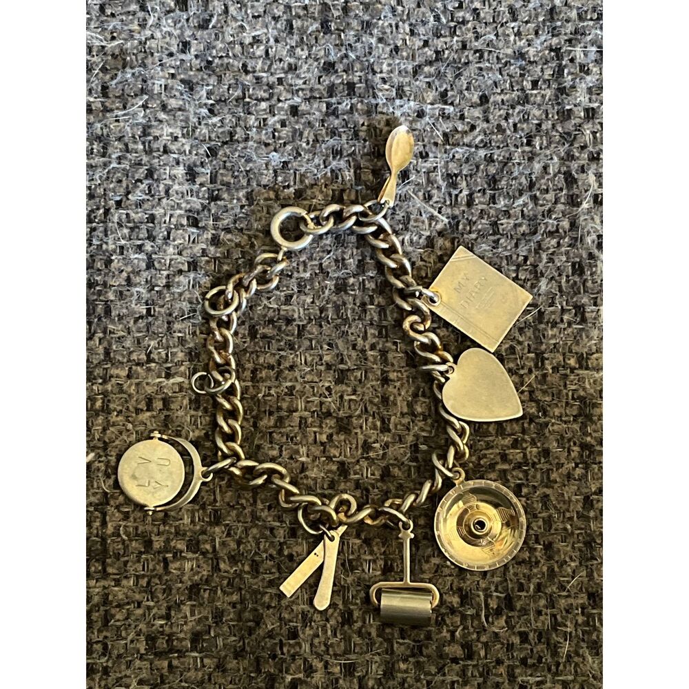 Vintage metal charm bracelet with movable charms